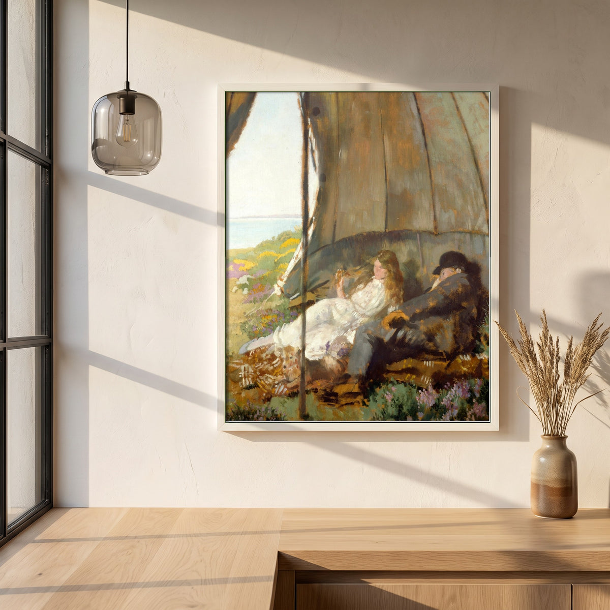 Looking at the Sea framed print in a white frame on a plaster wall above an oak worktop in a bright Scandinavian kitchen