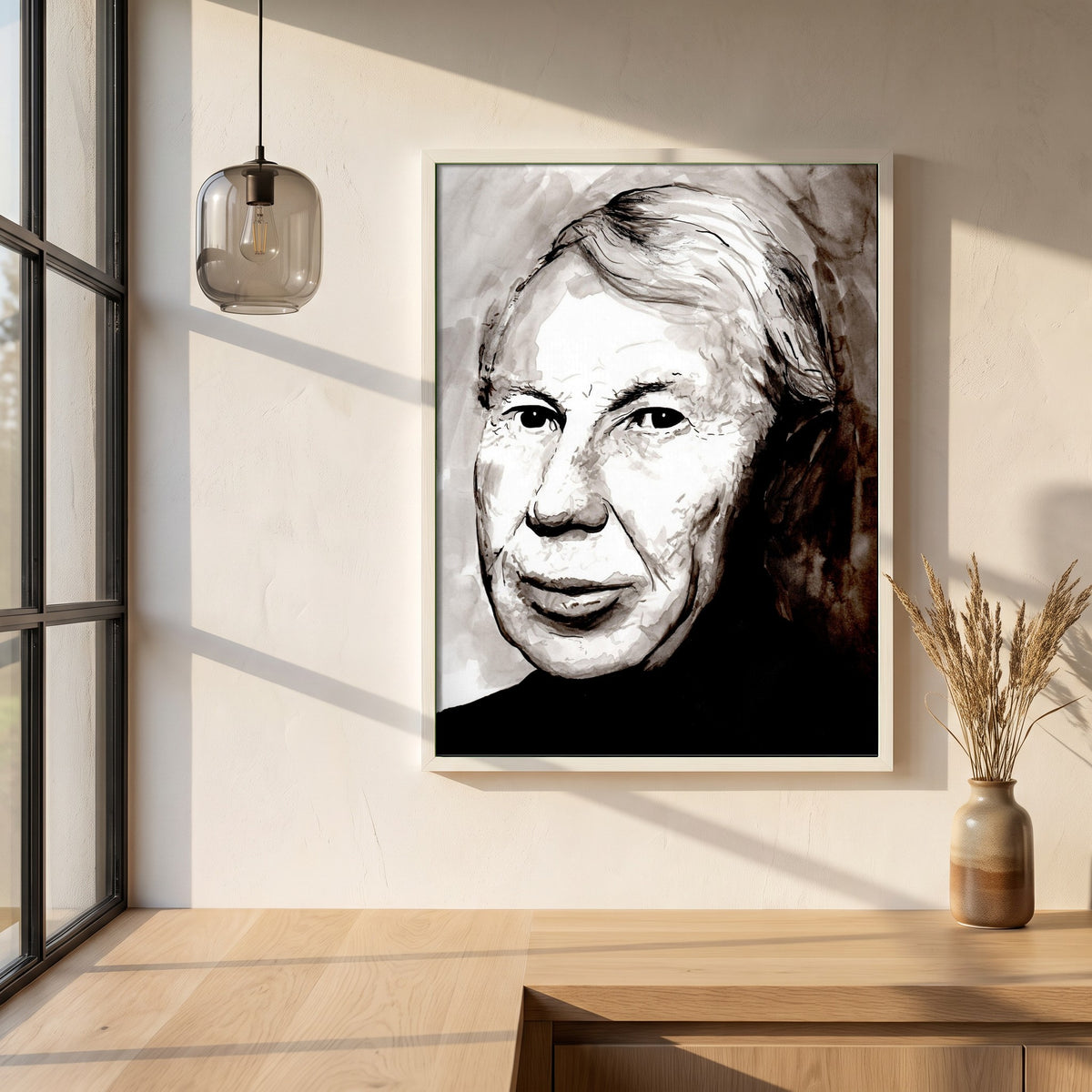 Louis le Brocquy Portrait framed print in a white frame on a plaster wall above an oak worktop in a bright Scandinavian kitchen