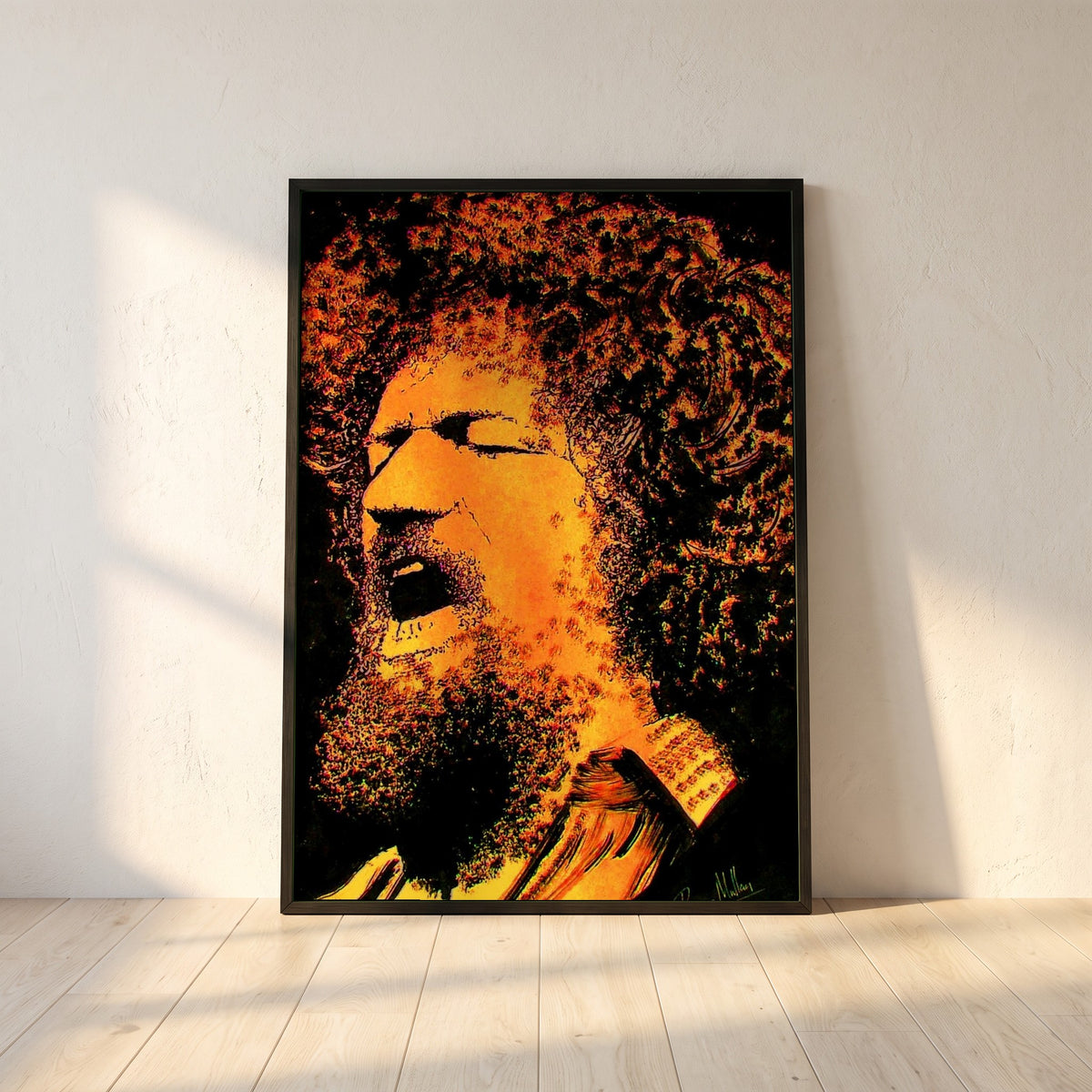 Luke Kelly framed print in a black frame leaning against a white plaster wall on oak floorboards in morning light