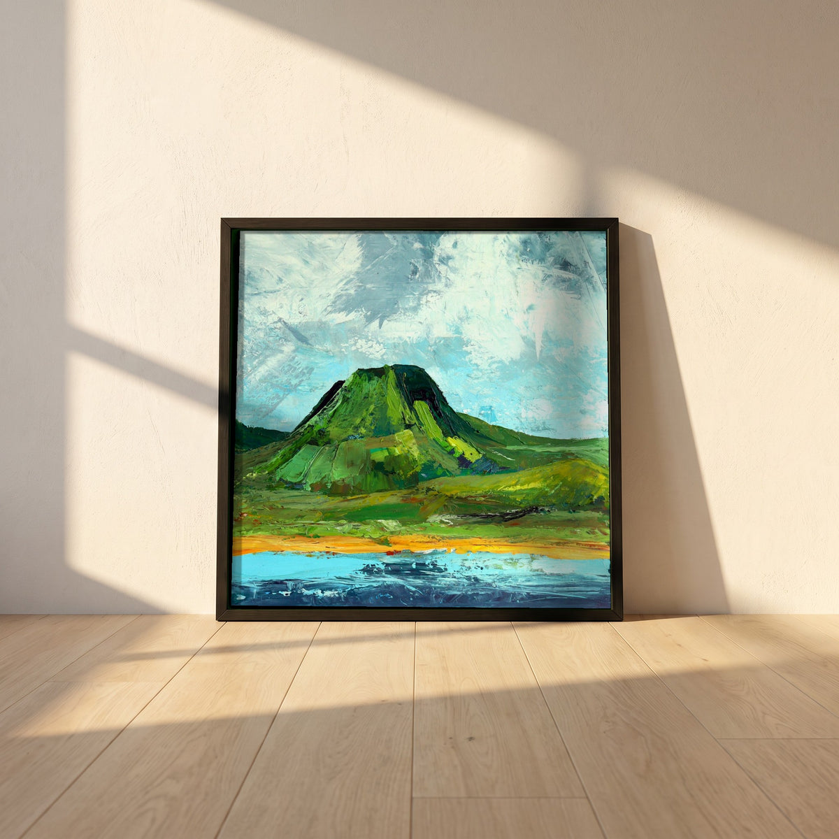 Lurig Mountain, Cushendall framed print in a black frame leaning against a white plaster wall on oak floorboards in morning light