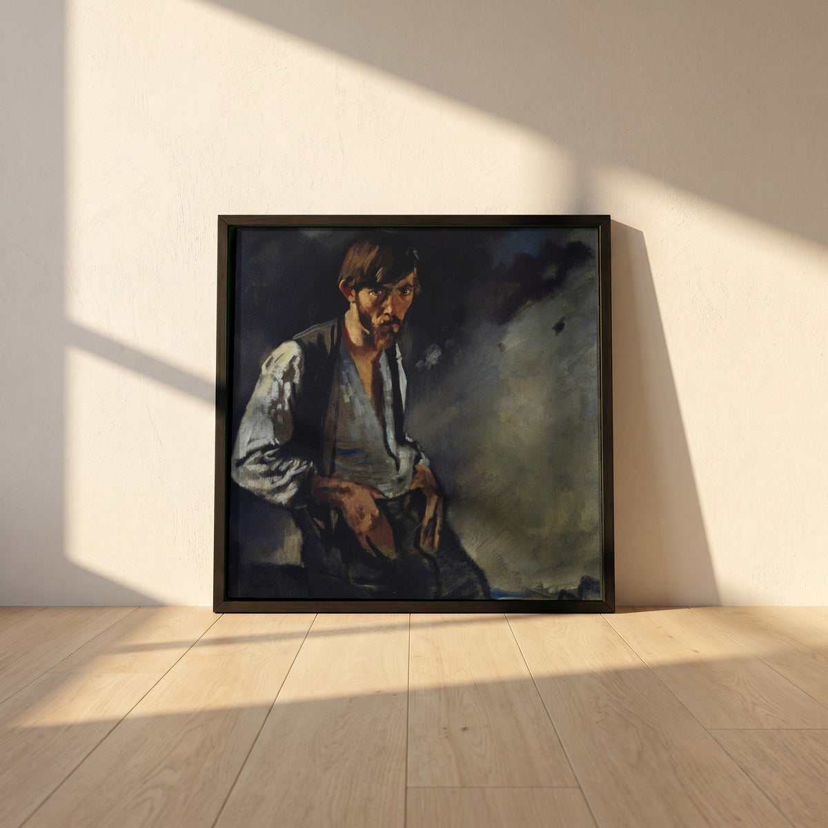 Man of the West, Seán Keating framed print in a black frame leaning against a white plaster wall on oak floorboards in morning light