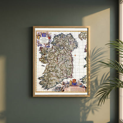 Visscher 1689 Map of Ireland Art Print | Historic Irish Cartography framed print in a natural oak frame on a dark green wall beside a window, dappled plant shadow