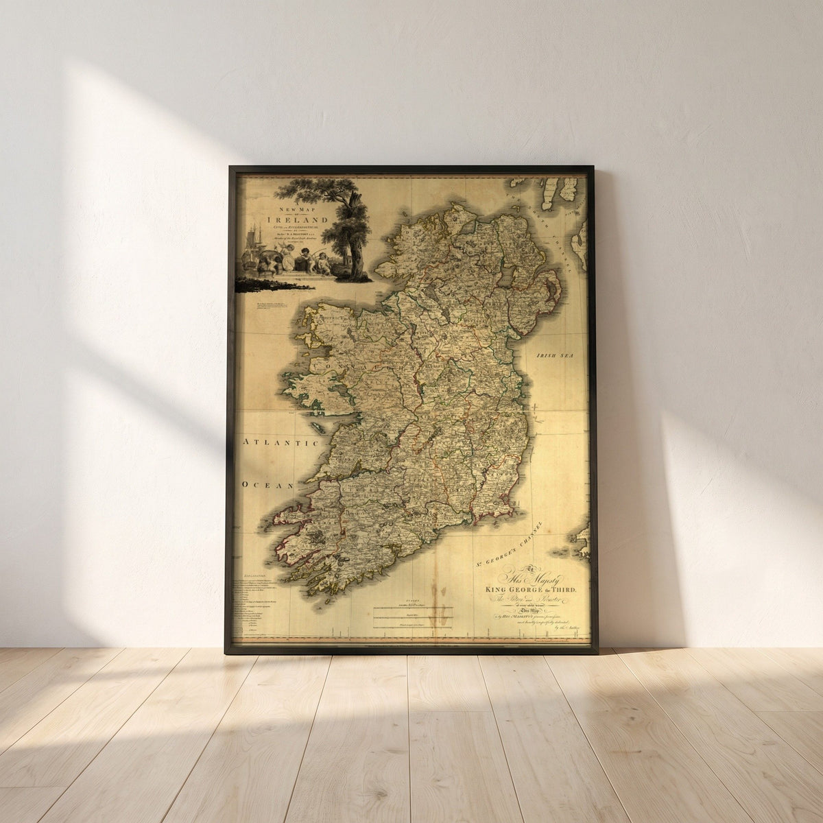 Memoir of a Map of Ireland by Daniel Augustus Beaufort framed print in a black frame leaning against a white plaster wall on oak floorboards in morning light