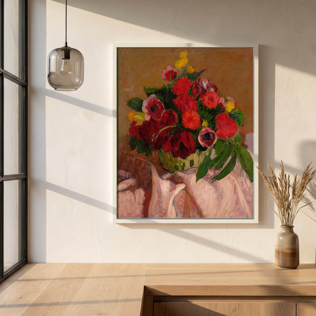 Mixed Flowers on Pink Cloth framed print in a white frame on a plaster wall above an oak worktop in a bright Scandinavian kitchen