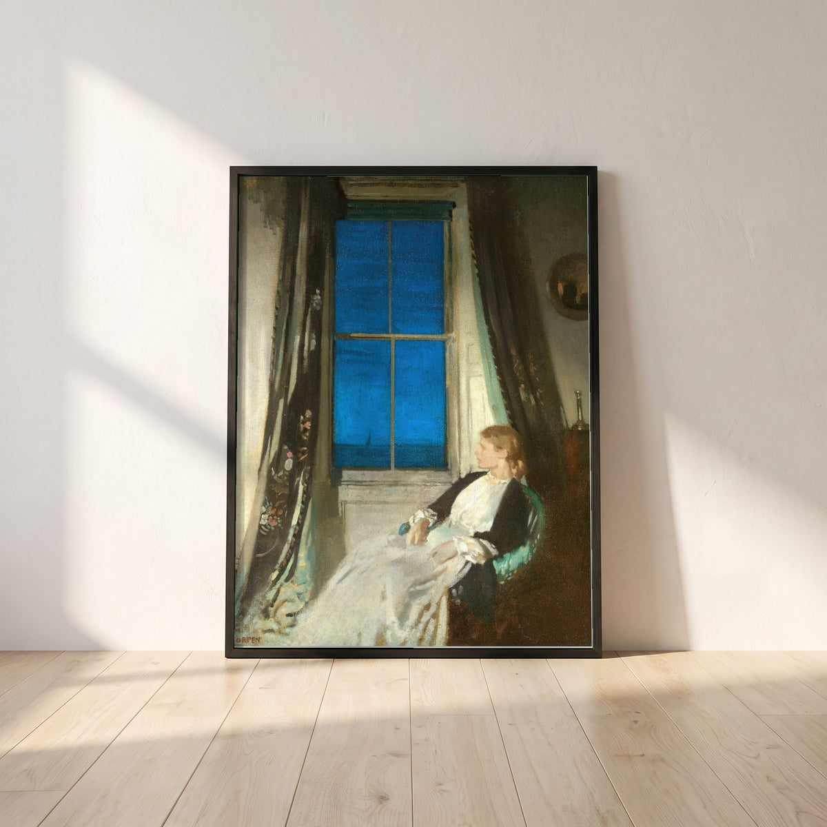 Night framed print in a black frame leaning against a white plaster wall on oak floorboards in morning light