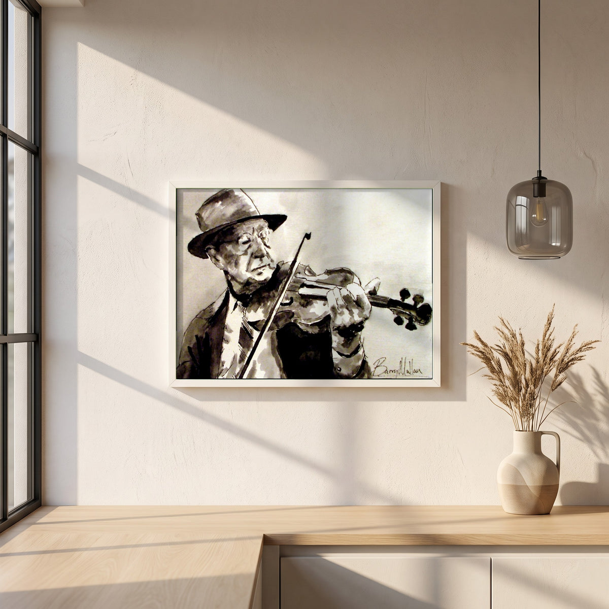 Old Irish Traditional Fiddle Player framed print in a white frame on a plaster wall above an oak worktop in a bright Scandinavian kitchen