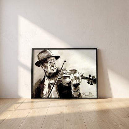 Old Irish Traditional Fiddle Player framed print in a black frame leaning against a white plaster wall on oak floorboards in morning light
