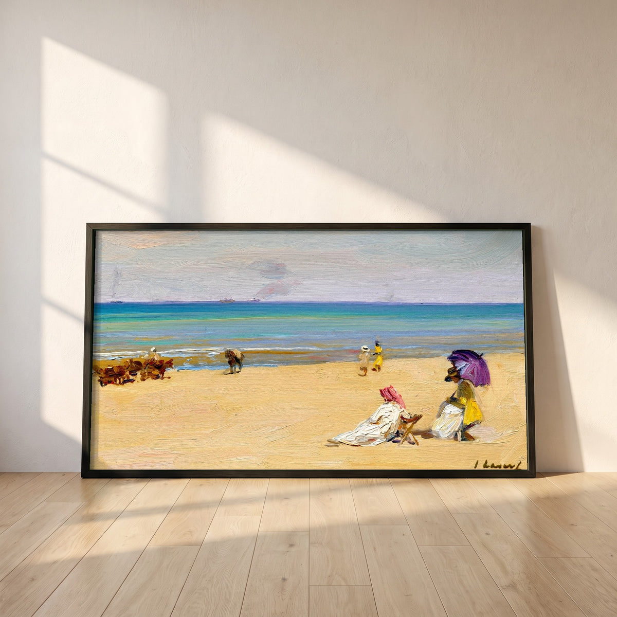 On The Sands framed print in a black frame leaning against a white plaster wall on oak floorboards in morning light