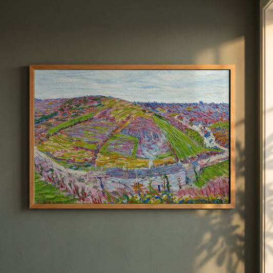 Paysage, Pont Aven framed print in a natural oak frame on a dark green wall beside a window, dappled plant shadow