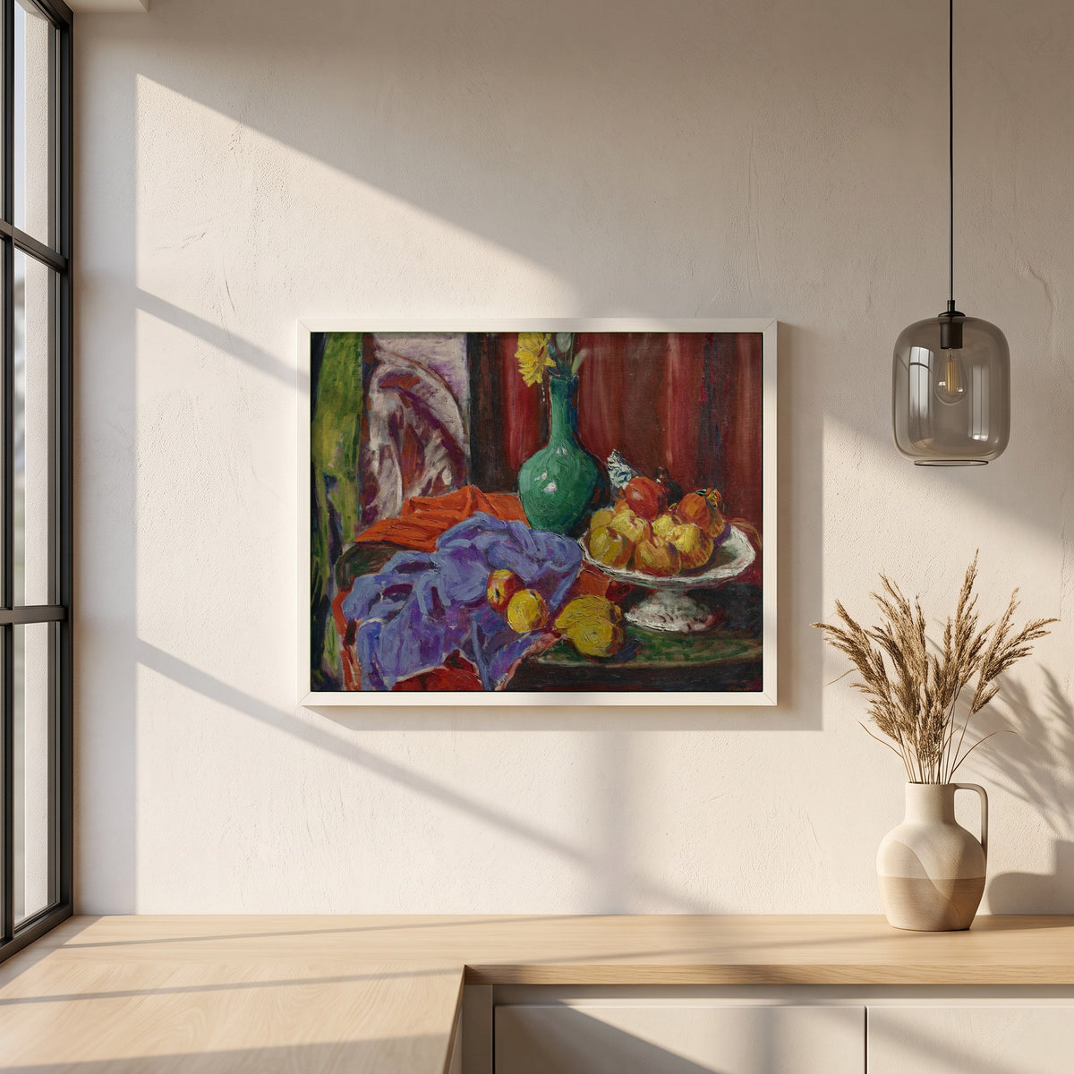 Roderic O’Conor framed print in a white frame on a plaster wall above an oak worktop in a bright Scandinavian kitchen