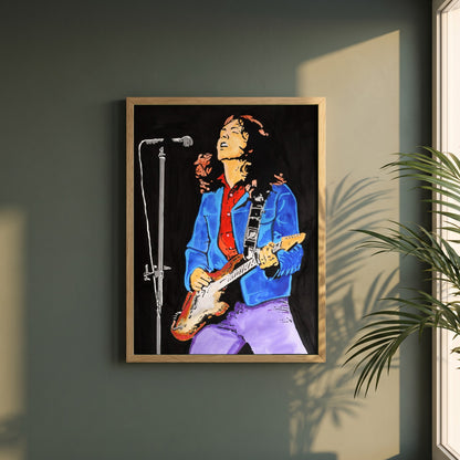 Rory Gallagher framed print in a natural oak frame on a dark green wall beside a window, dappled plant shadow