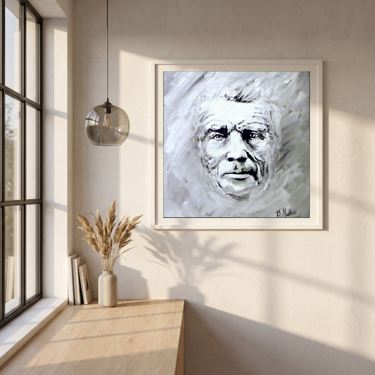 Samuel Beckett Portrait framed print in a white frame on a plaster wall above an oak worktop in a bright Scandinavian kitchen