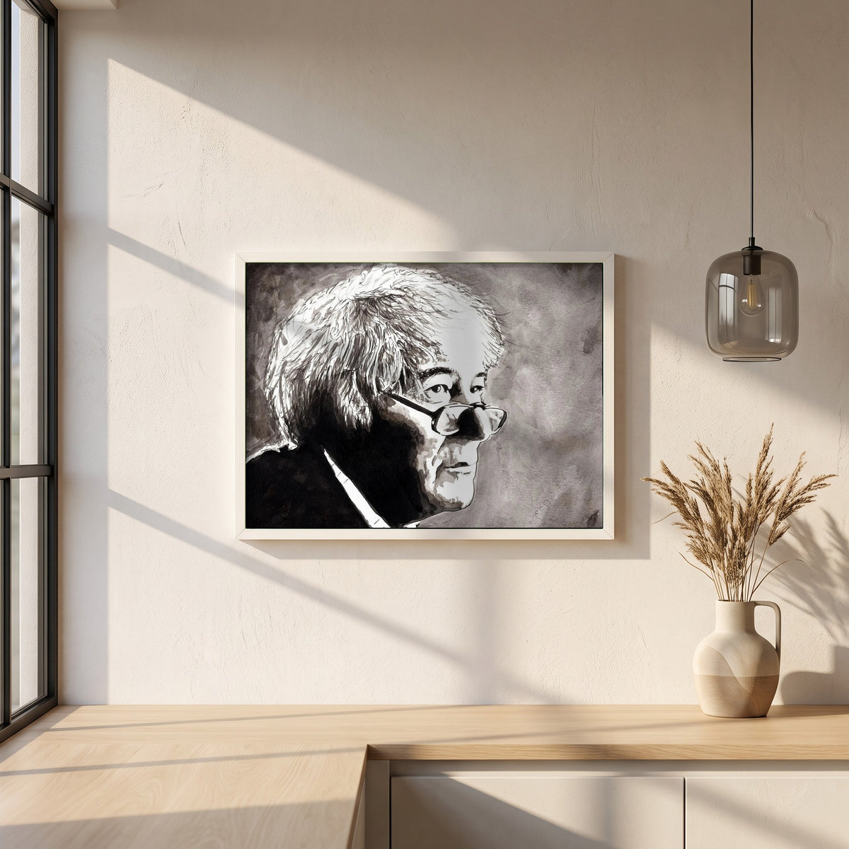 Seamus Heaney framed print in a white frame on a plaster wall above an oak worktop in a bright Scandinavian kitchen