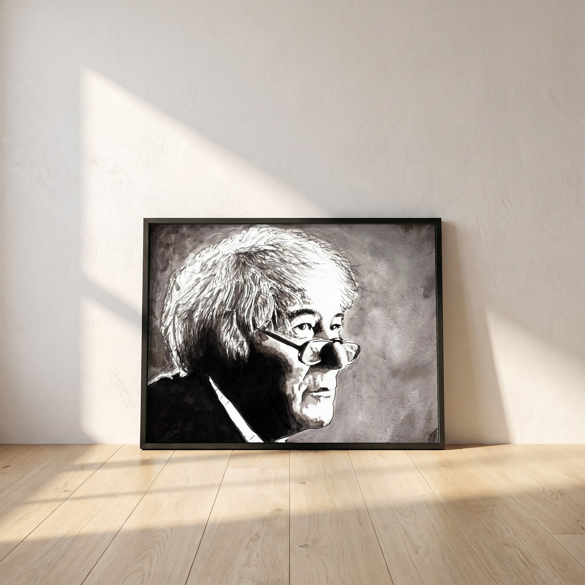 Seamus Heaney framed print in a black frame leaning against a white plaster wall on oak floorboards in morning light