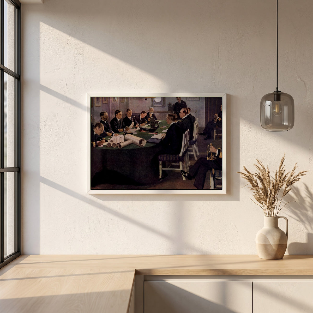 Admiral Sir David Beatty Reading the Terms of the Armistice framed print in a white frame on a plaster wall above an oak worktop in a bright Scandinavian kitchen