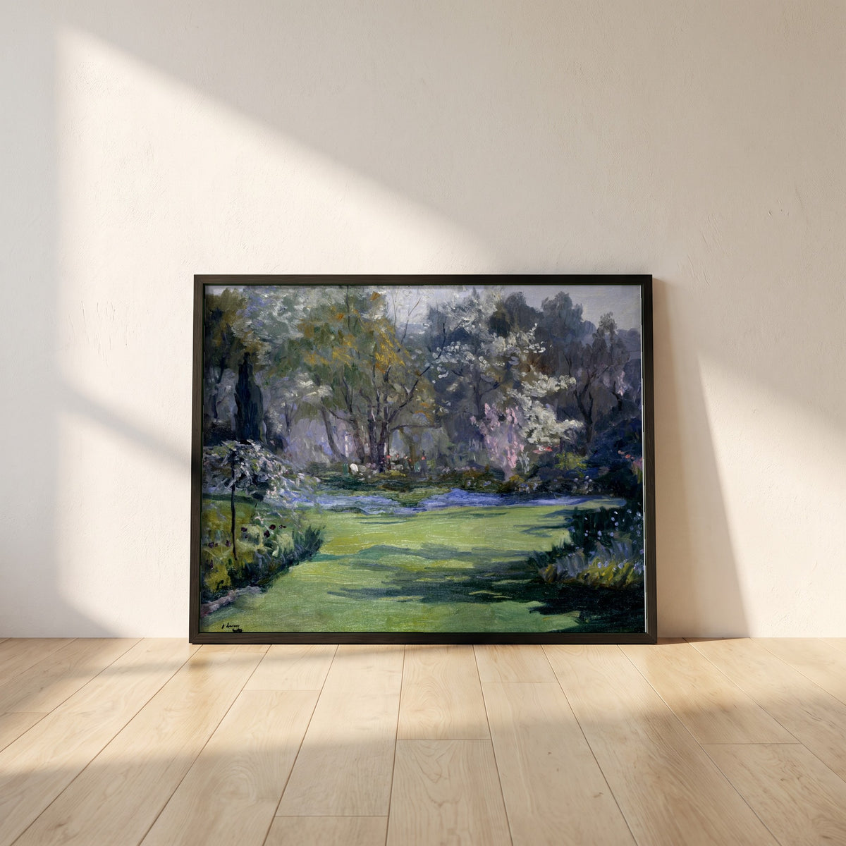 Spring, the Garden, Villa Sylvia framed print in a black frame leaning against a white plaster wall on oak floorboards in morning light