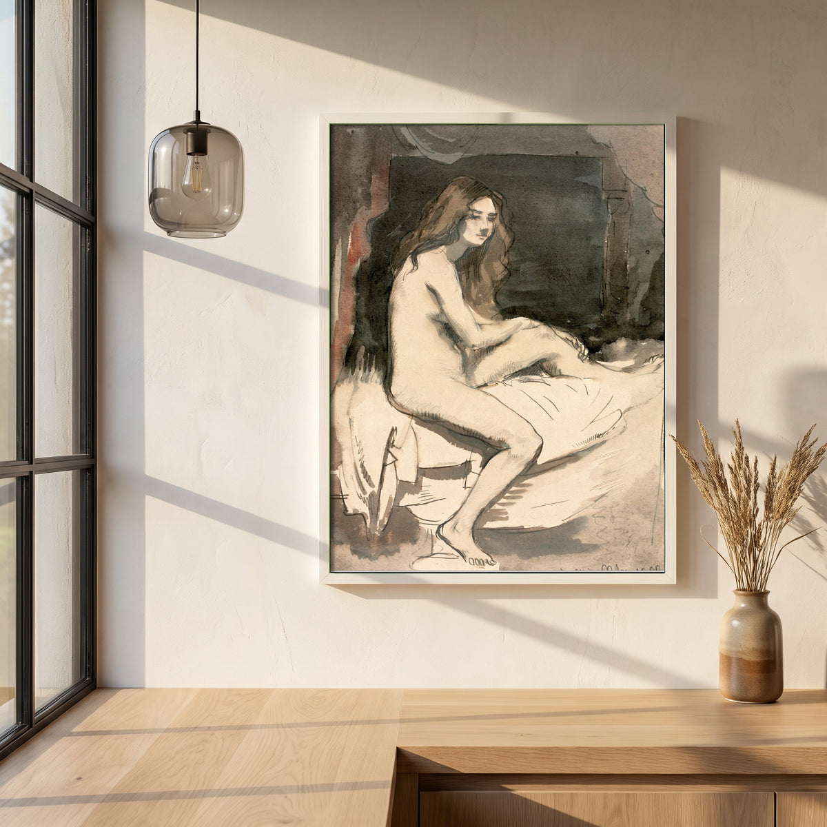 Seated Female Figure framed print in a white frame on a plaster wall above an oak worktop in a bright Scandinavian kitchen