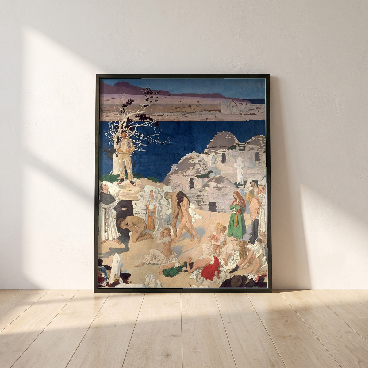 The Holy Well framed print in a black frame leaning against a white plaster wall on oak floorboards in morning light
