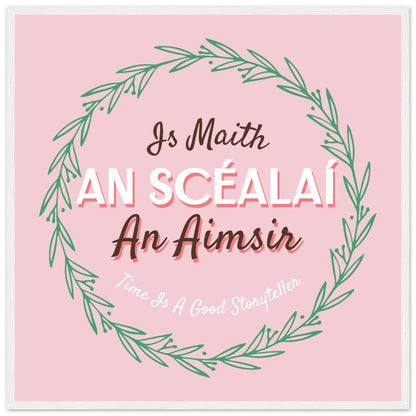 Time Is A Good Storyteller as Gaeilge, pink print with leaf wreath and a thin white edge