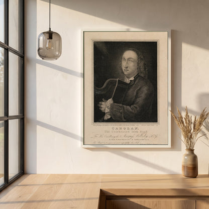 Turlough O’Carolan framed print in a white frame on a plaster wall above an oak worktop in a bright Scandinavian kitchen