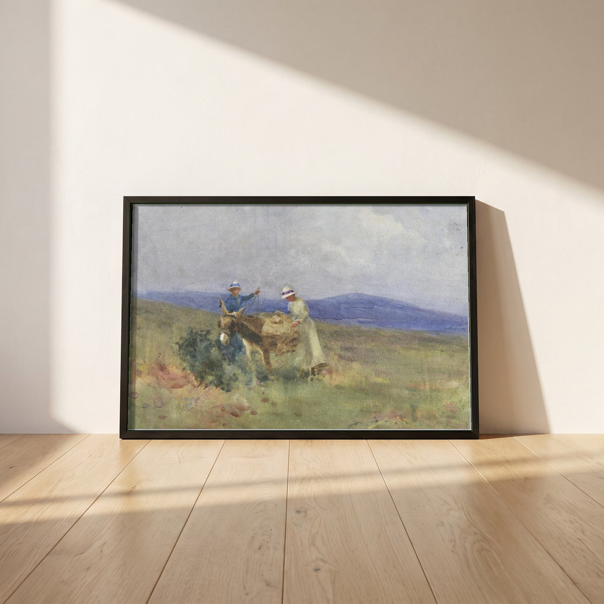 Unpacking the Picnic, Kerry framed print in a black frame leaning against a white plaster wall on oak floorboards in morning light