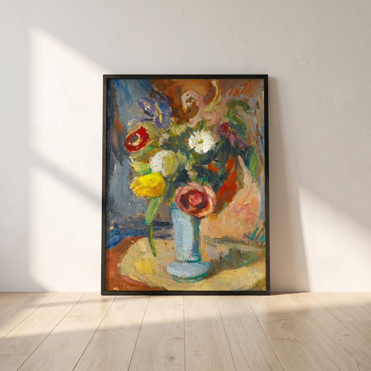 Still Life with Flowers framed print in a black frame leaning against a white plaster wall on oak floorboards in morning light