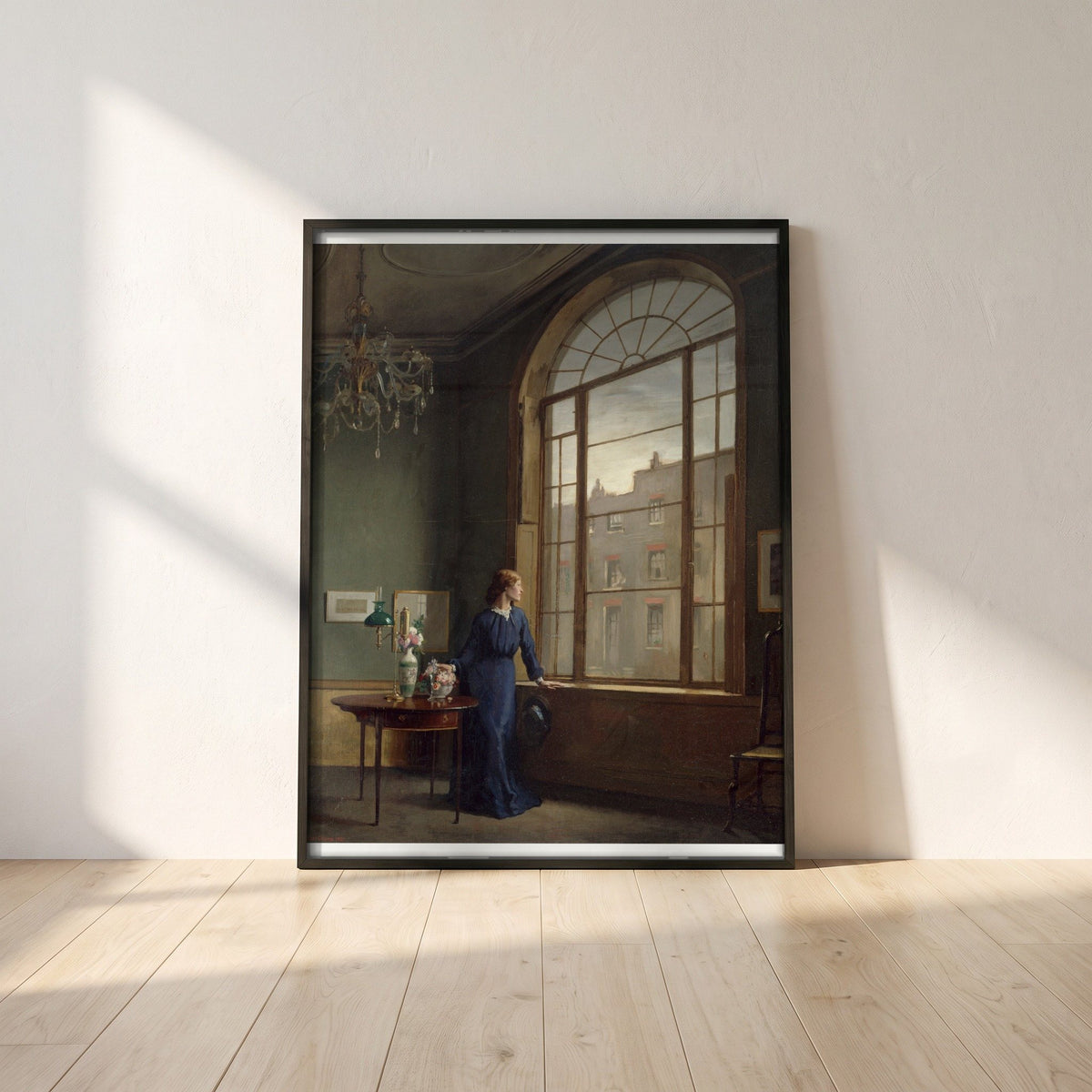Window in London Street framed print in a black frame leaning against a white plaster wall on oak floorboards in morning light