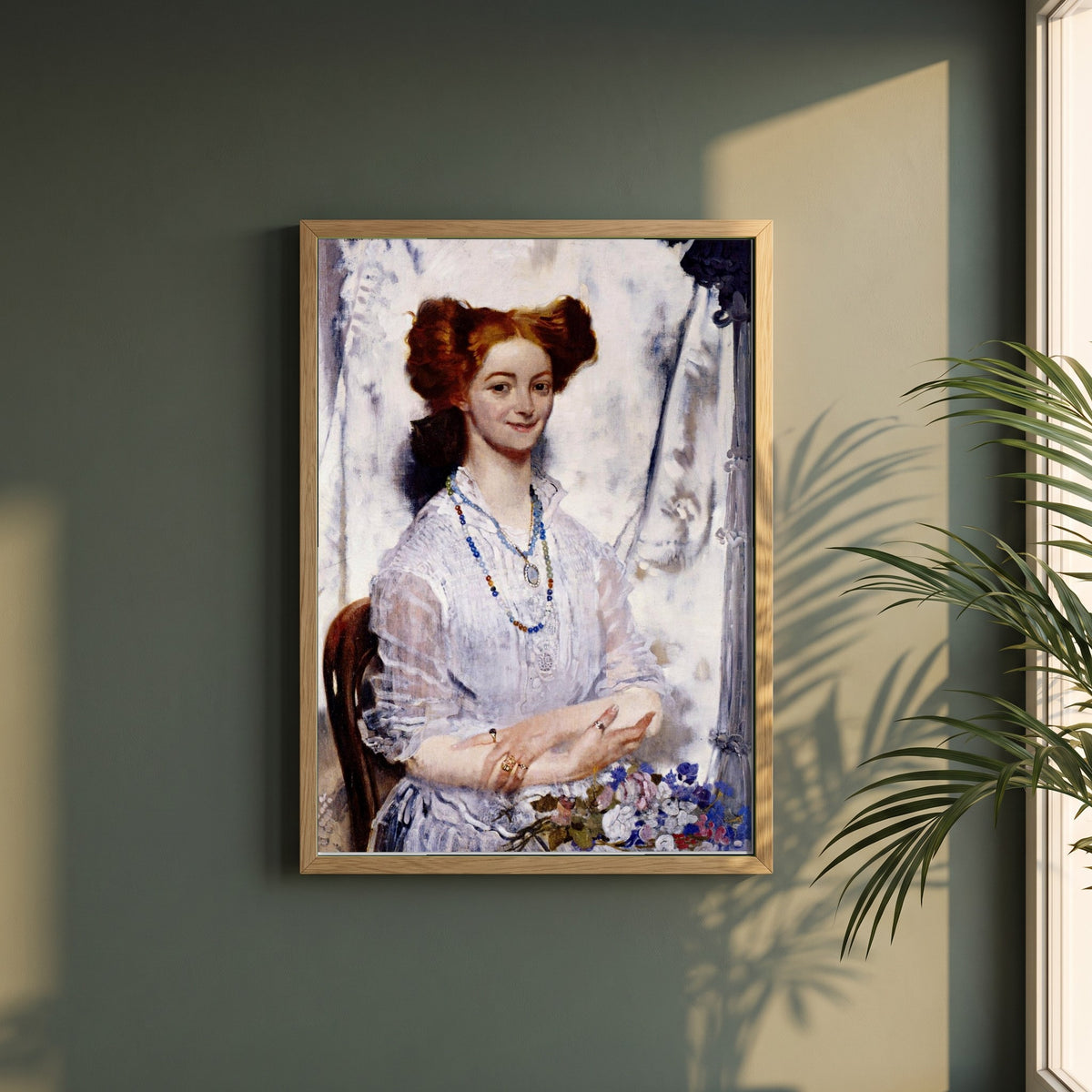 Young Ireland framed print in a natural oak frame on a dark green wall beside a window, dappled plant shadow