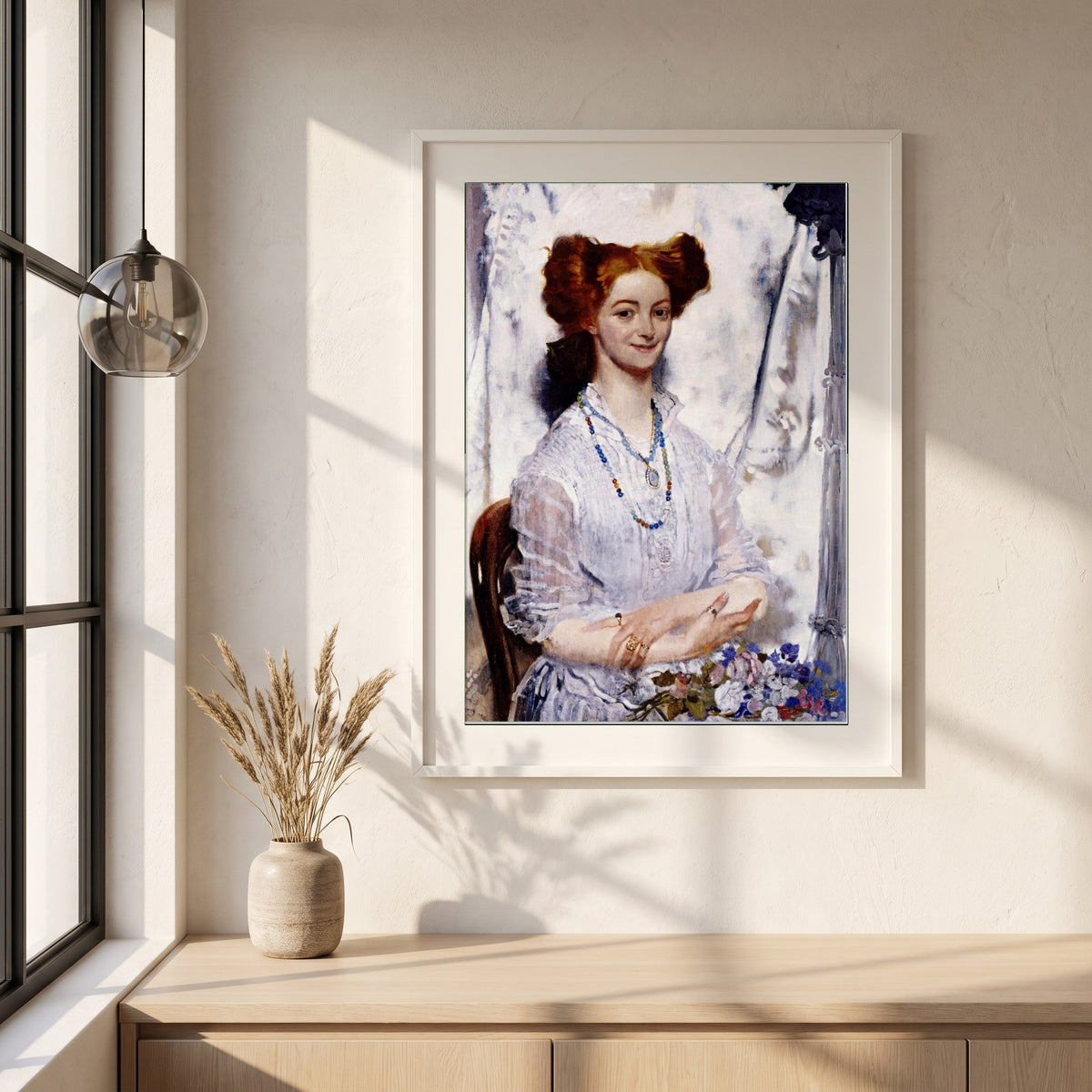 Young Ireland framed print in a white frame on a plaster wall above an oak worktop in a bright Scandinavian kitchen